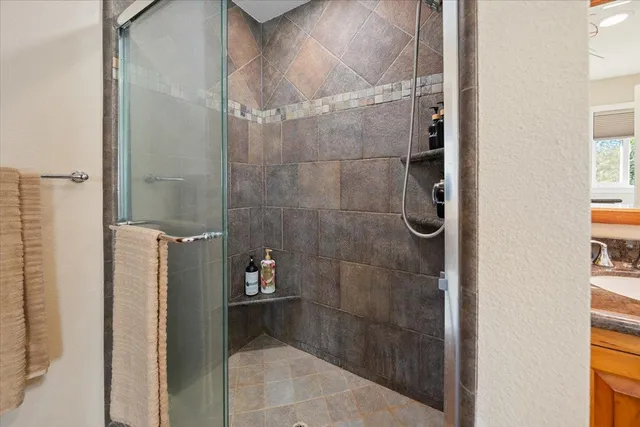a view of a table and chairs in the garden