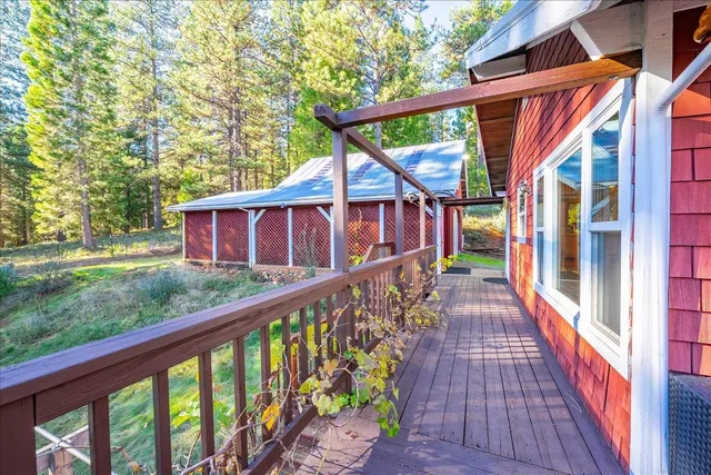 a living room with furniture and floor to ceiling windows