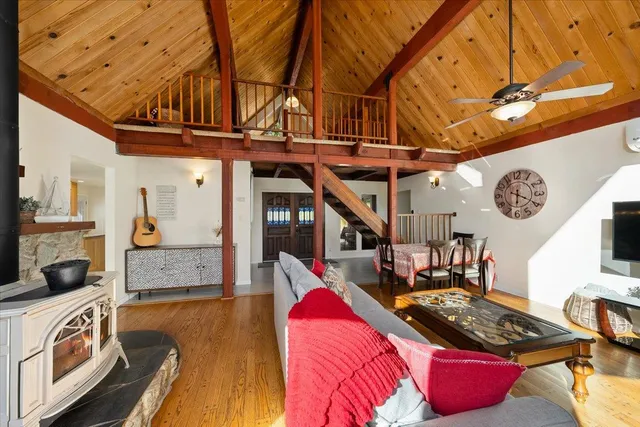 a view of a dining room with furniture wooden floor and a rug