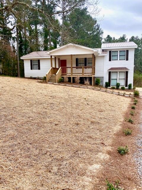 63 Norton Road Kingston, GA 30145 - Photo 1 of 1 a front view of a house with yard and trees
