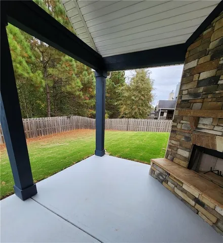 a view of backyard with green space