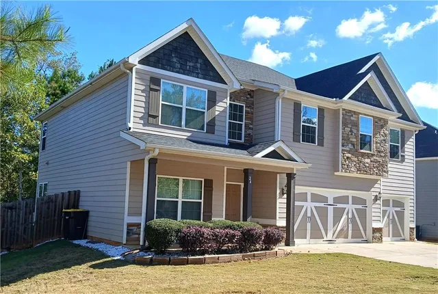 a front view of a house with swimming pool