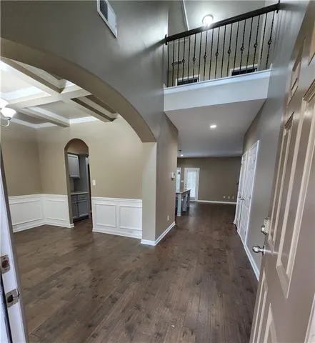 a view of a hallway with staircase