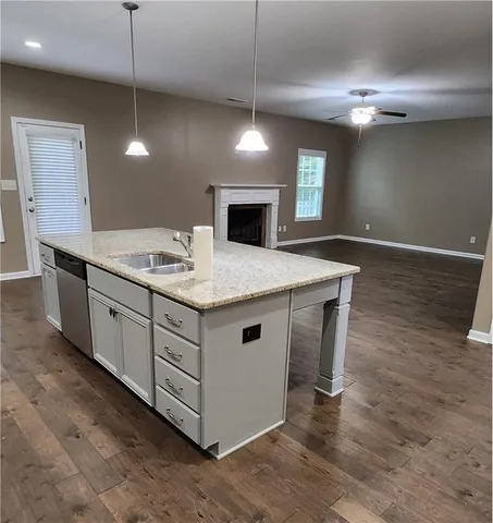 a bathroom with a sink a vanity and a mirror