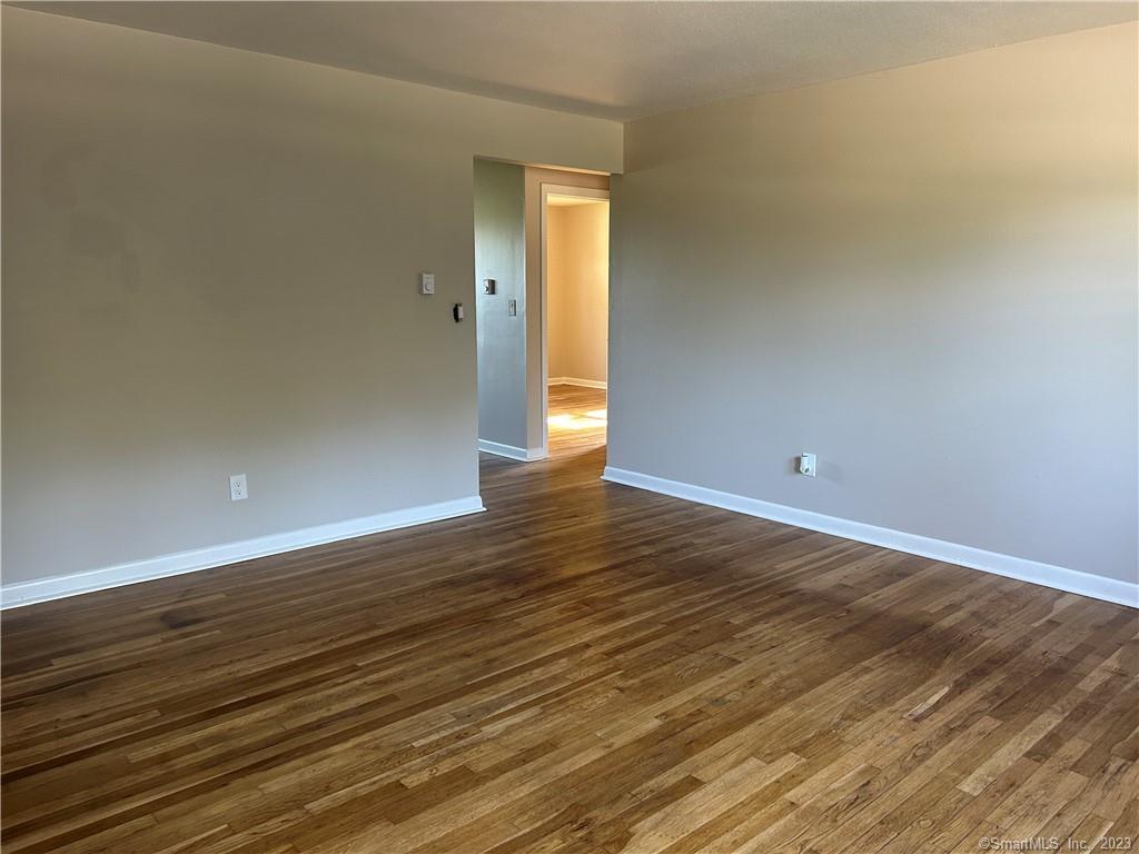 12 Baker Road, Unit 2 Windham, CT 06256 - Photo 1 of 1 a view of an empty room and wooden floor