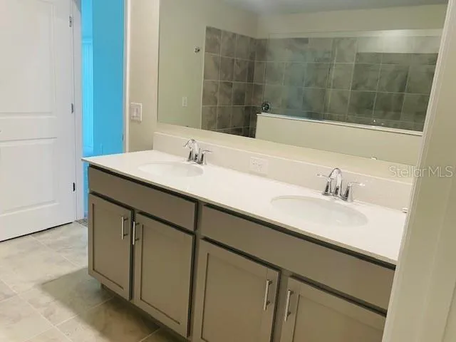 a bathroom with a sink and a mirror