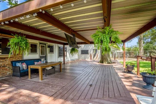 an aerial view of a residential houses with swimming pool