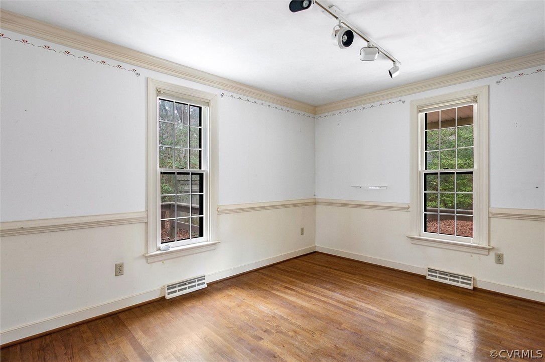 3802 Pebble Creek Road Midlothian, VA 23112 - Photo 12 of 25 an empty room with wooden floor and windows