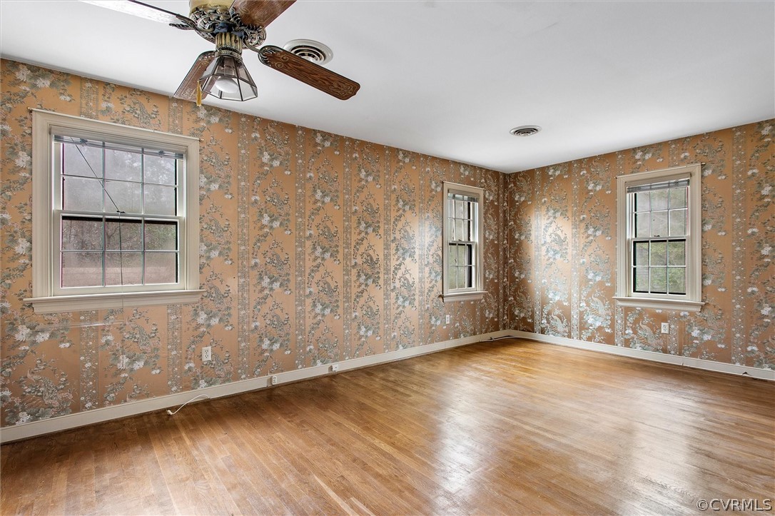 3802 Pebble Creek Road Midlothian, VA 23112 - Photo 13 of 25 wooden floor in an empty room with a window