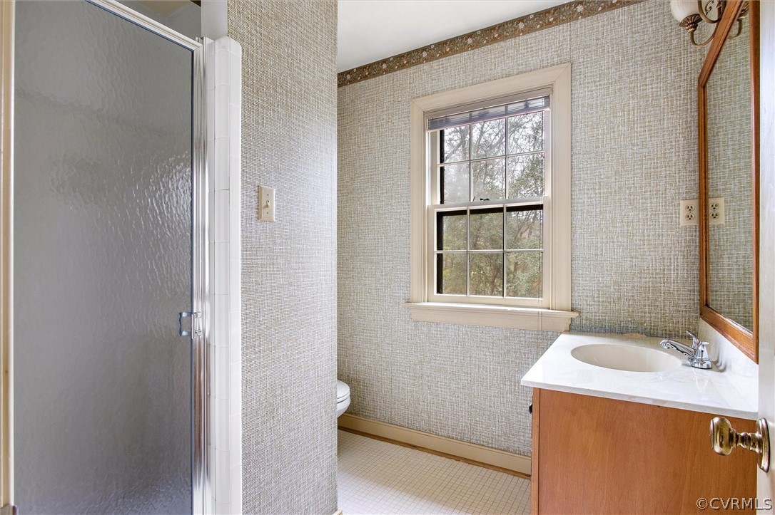 3802 Pebble Creek Road Midlothian, VA 23112 - Photo 15 of 25 a bathroom with a sink and a window