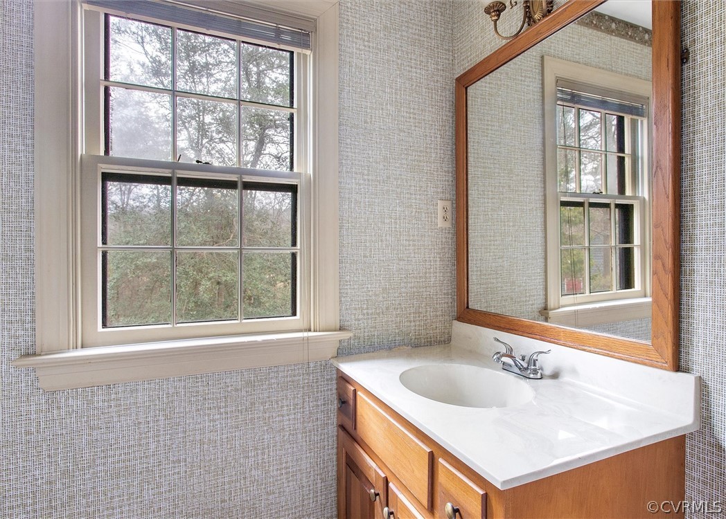 3802 Pebble Creek Road Midlothian, VA 23112 - Photo 16 of 25 a bathroom with a sink and a window