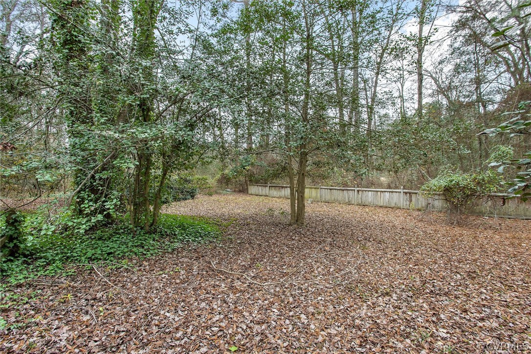 3802 Pebble Creek Road Midlothian, VA 23112 - Photo 23 of 25 a view of a yard with a tree