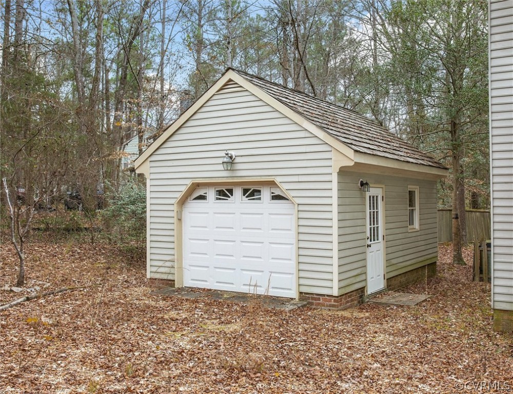 3802 Pebble Creek Road Midlothian, VA 23112 - Photo 25 of 25 a view of a small house with a small yard and large tree