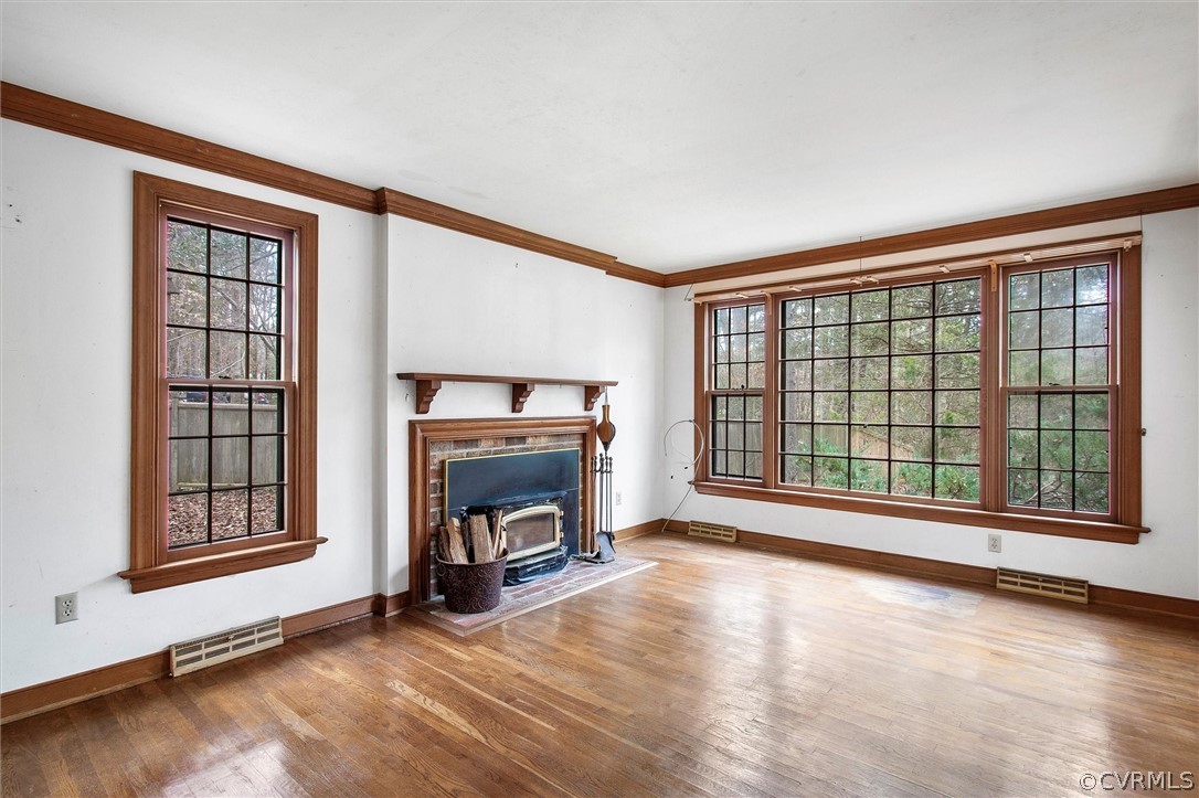 3802 Pebble Creek Road Midlothian, VA 23112 - Photo 4 of 25 a view of an empty room with a fireplace and a window