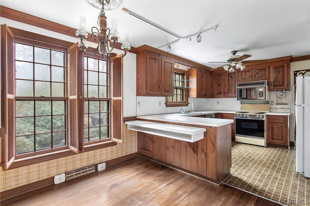 3802 Pebble Creek Road Midlothian, VA 23112 - Photo 7 of 25 a kitchen with a stove kitchen island and windows
