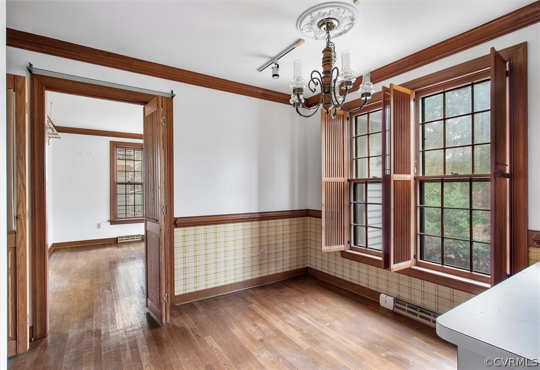 3802 Pebble Creek Road Midlothian, VA 23112 - Photo 10 of 25 a view of an empty room with window and wooden floor