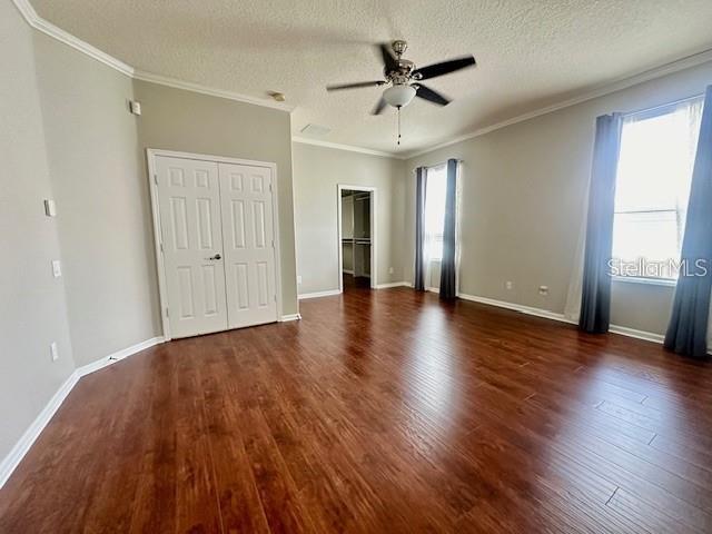 806 Winder Oaks Drive Gotha, FL 34734 - Photo 11 of 47 an empty room with wooden floor and ceiling fan