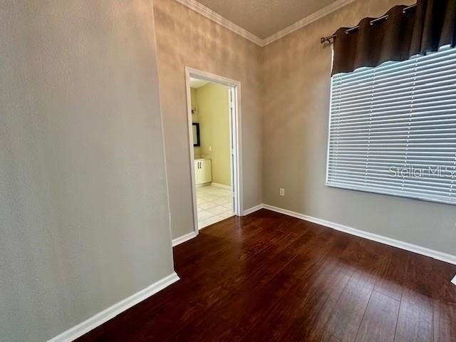 806 Winder Oaks Drive Gotha, FL 34734 - Photo 14 of 47 an empty room with wooden floor and windows