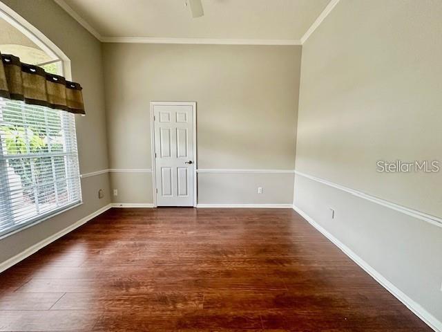 806 Winder Oaks Drive Gotha, FL 34734 - Photo 20 of 47 a view of an empty room with wooden floor and a window