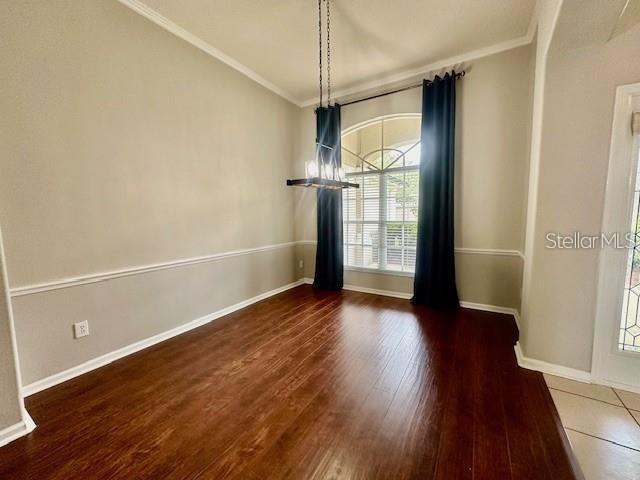 806 Winder Oaks Drive Gotha, FL 34734 - Photo 23 of 47 a view of a room with wooden floor and white walls