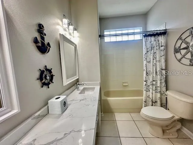 a bathroom with a toilet a sink and bathtub