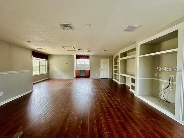 806 Winder Oaks Drive Gotha, FL 34734 - Photo 28 of 47 a view of empty room with wooden floor and fan