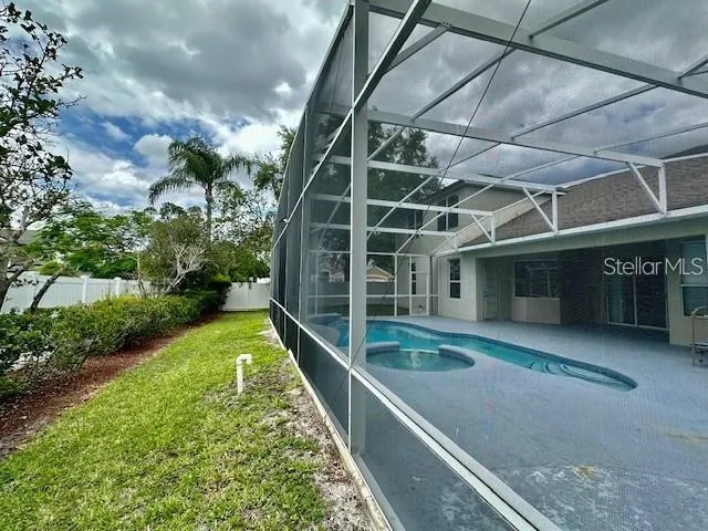a view of a backyard with sitting area