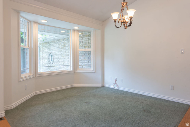875 East 1300th Street North Mapleton, UT 84664 - Photo 9 of 65 Unfurnished dining area featuring hanging lights and carpet