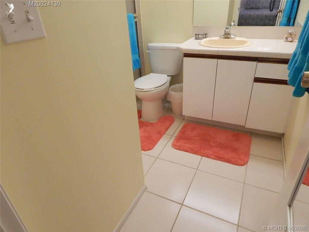 2950 Southeast Ocean Boulevard, Unit 1225 Stuart, FL 34996 - Photo 16 of 39 a bathroom with a sink and a toilet