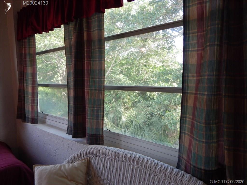 2950 Southeast Ocean Boulevard, Unit 1225 Stuart, FL 34996 - Photo 27 of 39 a view of a room that has a bed and a window