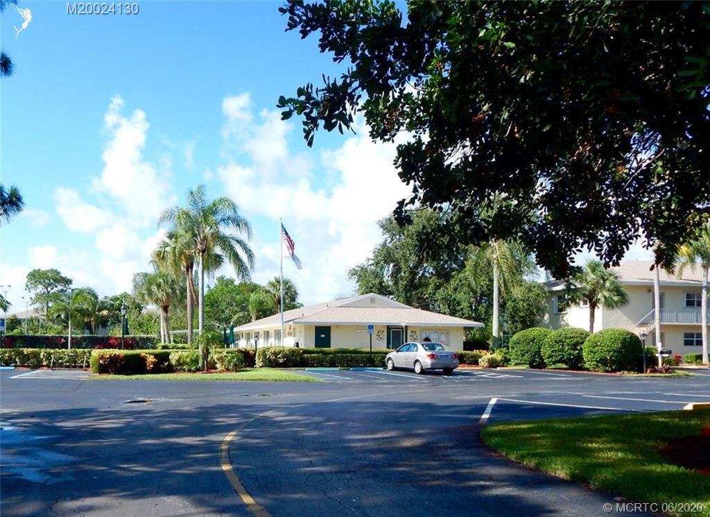 2950 Southeast Ocean Boulevard, Unit 1225 Stuart, FL 34996 - Photo 33 of 39 a view of a town with large trees and barn