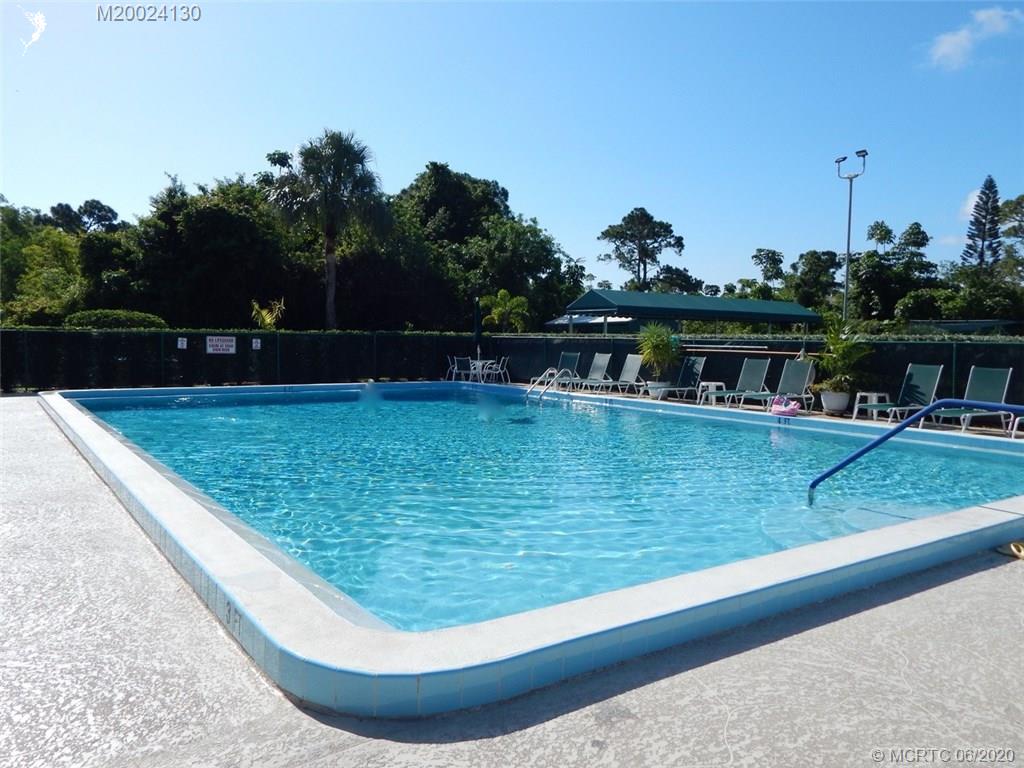2950 Southeast Ocean Boulevard, Unit 1225 Stuart, FL 34996 - Photo 34 of 39 a view of swimming pool with outdoor seating