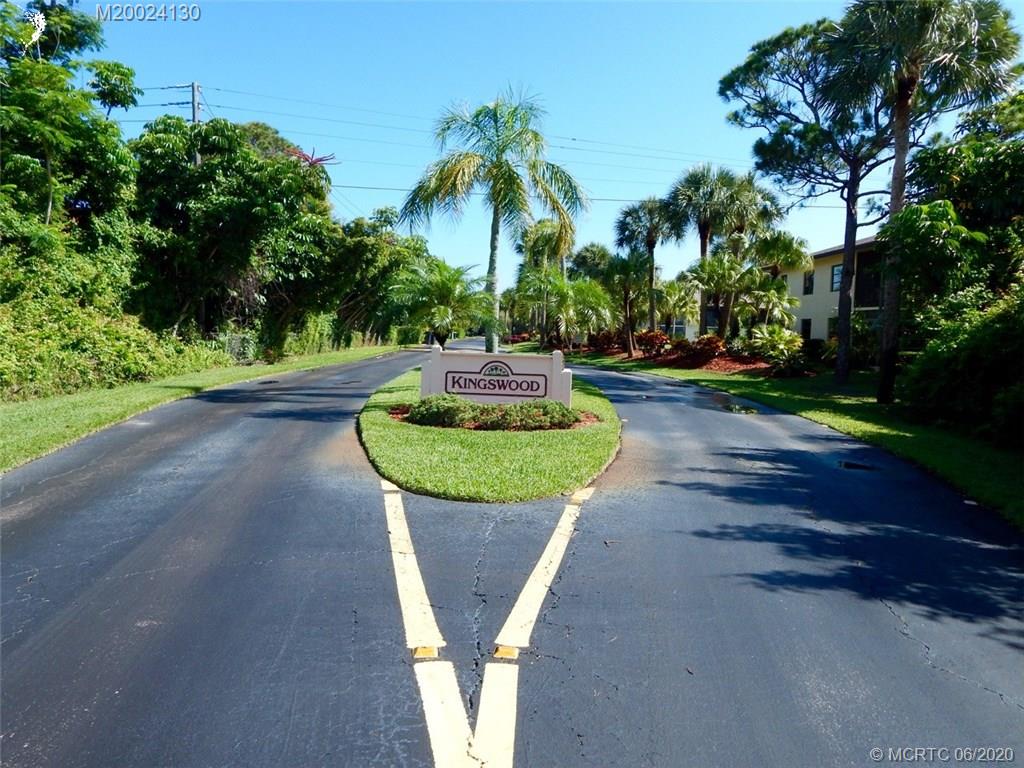 2950 Southeast Ocean Boulevard, Unit 1225 Stuart, FL 34996 - Photo 39 of 39 a view of a table and chairs in a garden
