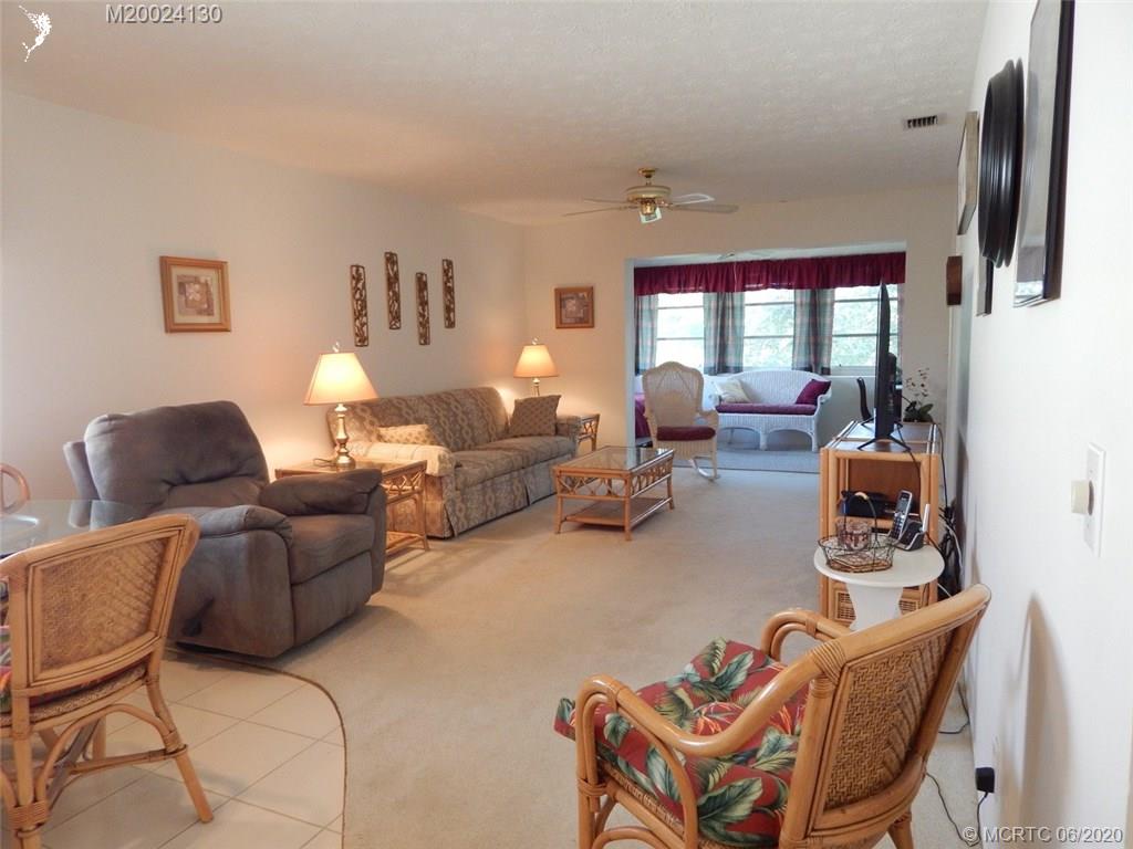 2950 Southeast Ocean Boulevard, Unit 1225 Stuart, FL 34996 - Photo 5 of 39 a living room with furniture and a window