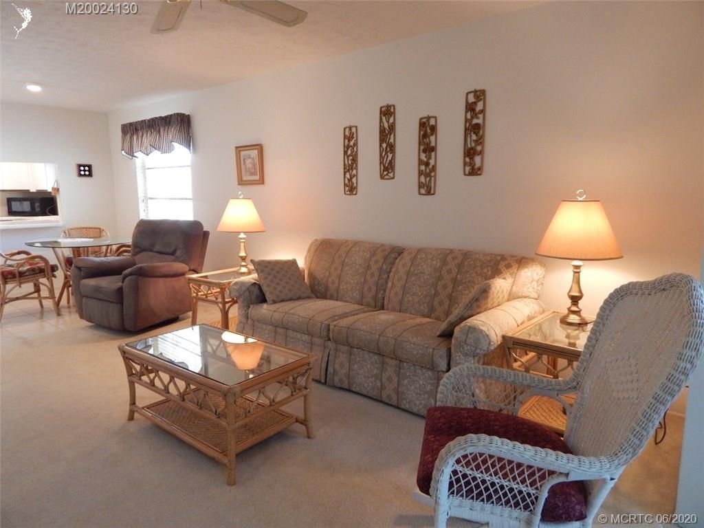 2950 Southeast Ocean Boulevard, Unit 1225 Stuart, FL 34996 - Photo 9 of 39 a living room with furniture