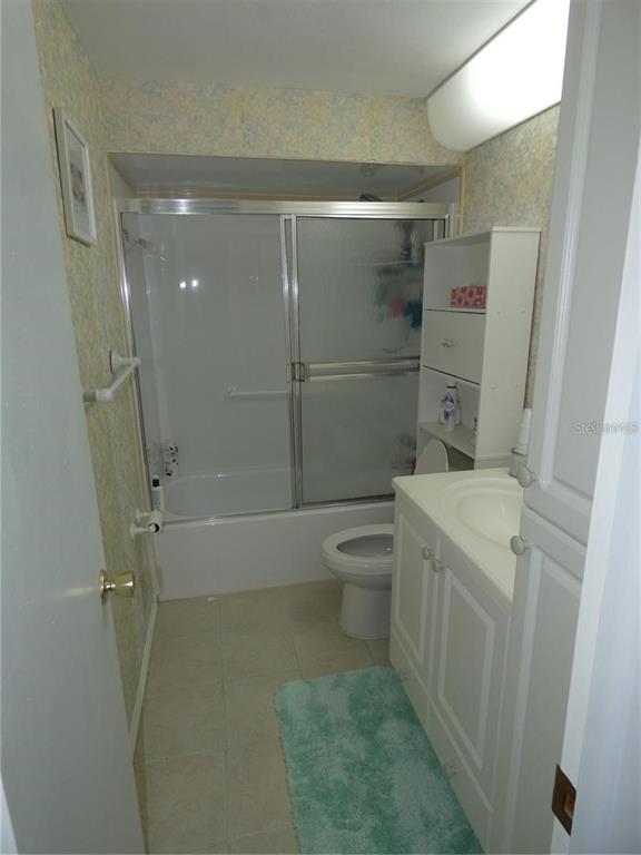 4392 Craftsbury Drive New Port Richey, FL 34652 - Photo 21 of 41 a bathroom with a shower toilet and sink