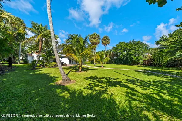 a bedroom with a bed dresser and a window
