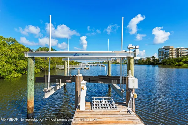 a living room with furniture a large window and a fireplace