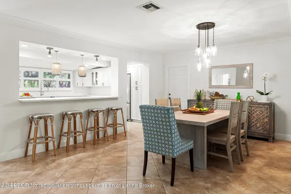 a kitchen with stainless steel appliances granite countertop a sink and a refrigerator