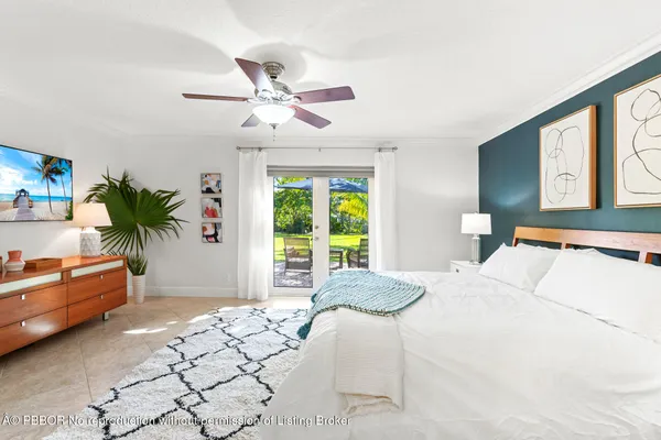 a bed room with a bed and a chandelier