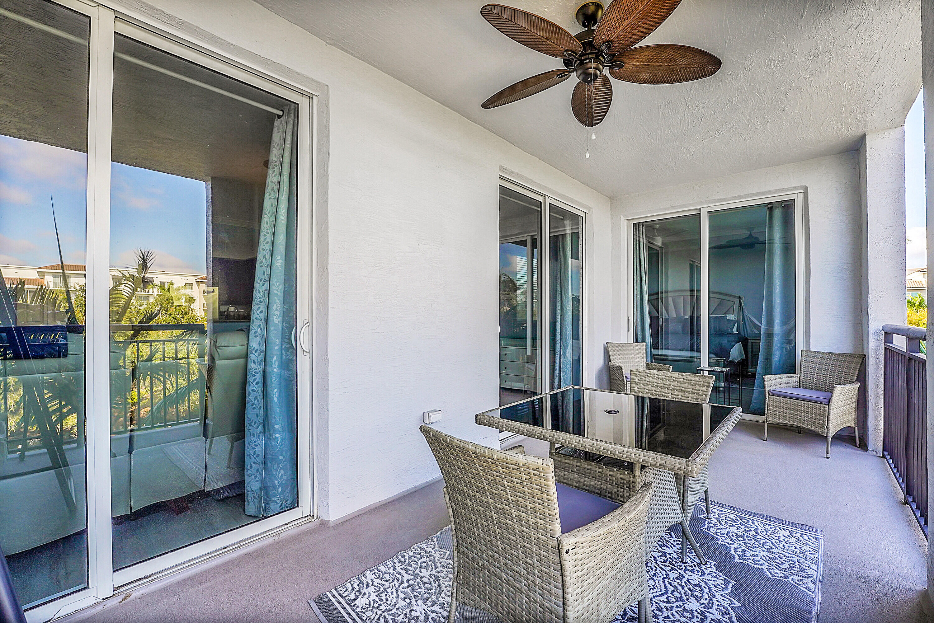1690 Renaissance Commons Boulevard, Unit 1401 Boynton Beach, FL 33426 - Photo 12 of 43 a living room with furniture and a large window