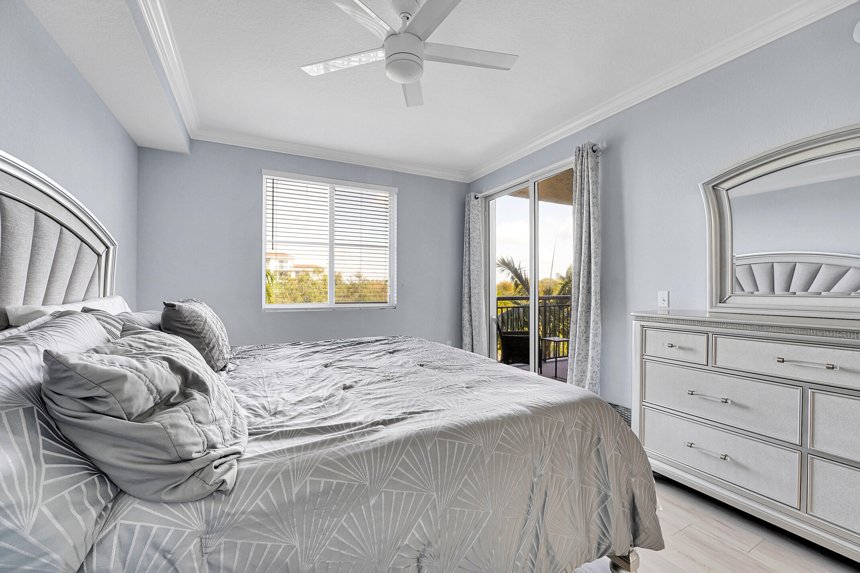 1690 Renaissance Commons Boulevard, Unit 1401 Boynton Beach, FL 33426 - Photo 18 of 43 a bedroom with a bed and a window