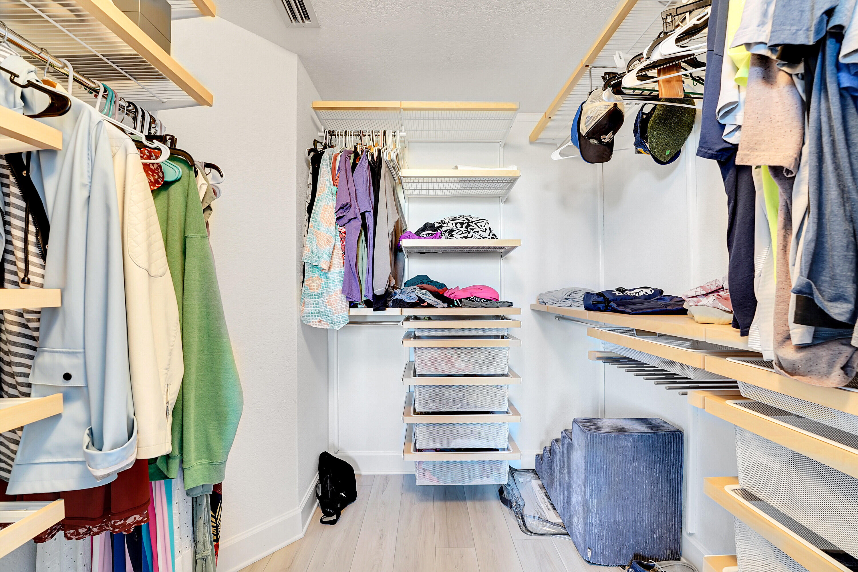1690 Renaissance Commons Boulevard, Unit 1401 Boynton Beach, FL 33426 - Photo 19 of 43 a view of walk in closet with clothes and shoes
