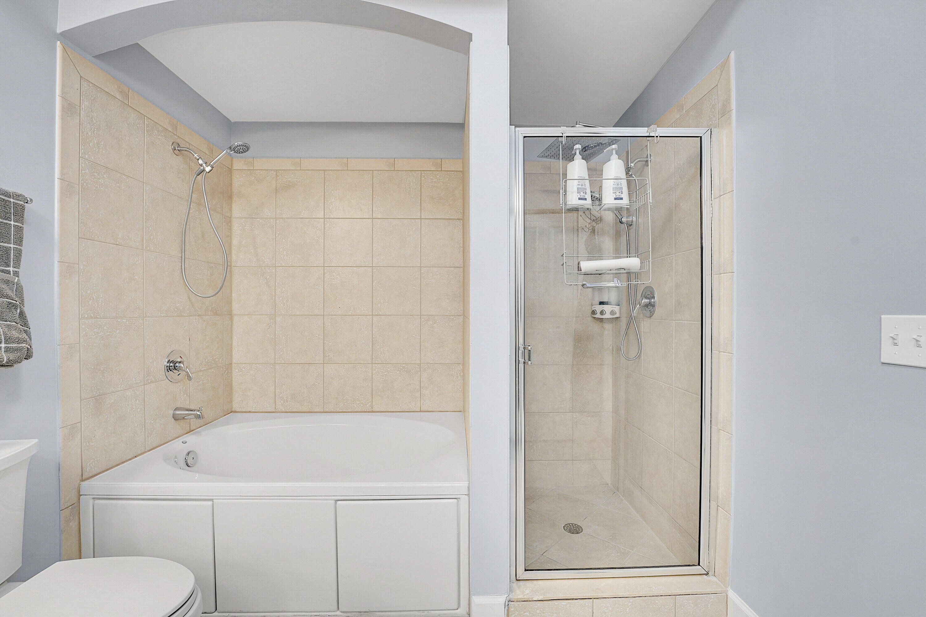 1690 Renaissance Commons Boulevard, Unit 1401 Boynton Beach, FL 33426 - Photo 21 of 43 a bathroom with a shower a toilet and sink