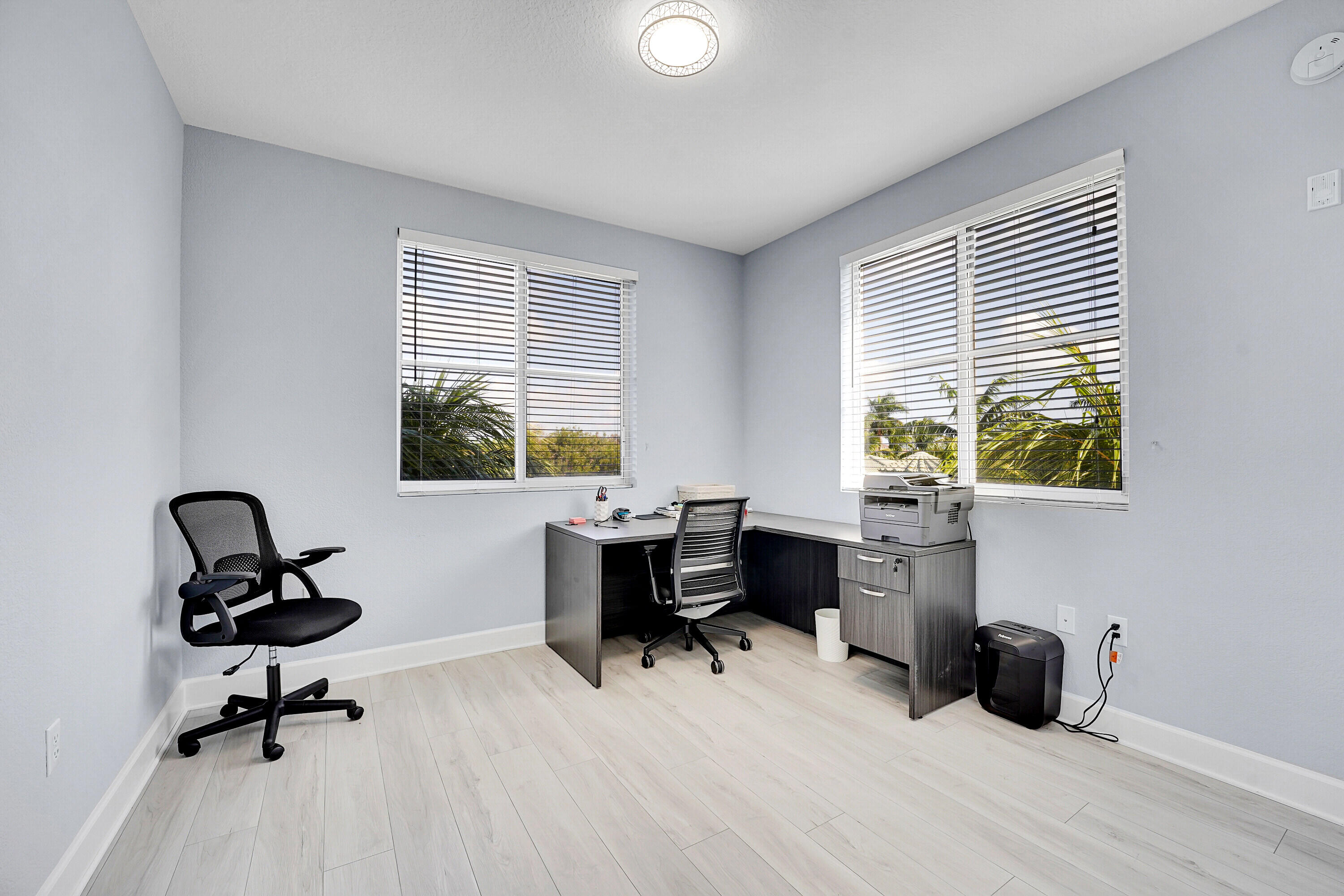 1690 Renaissance Commons Boulevard, Unit 1401 Boynton Beach, FL 33426 - Photo 24 of 43 a view of a workspace with furniture and a window