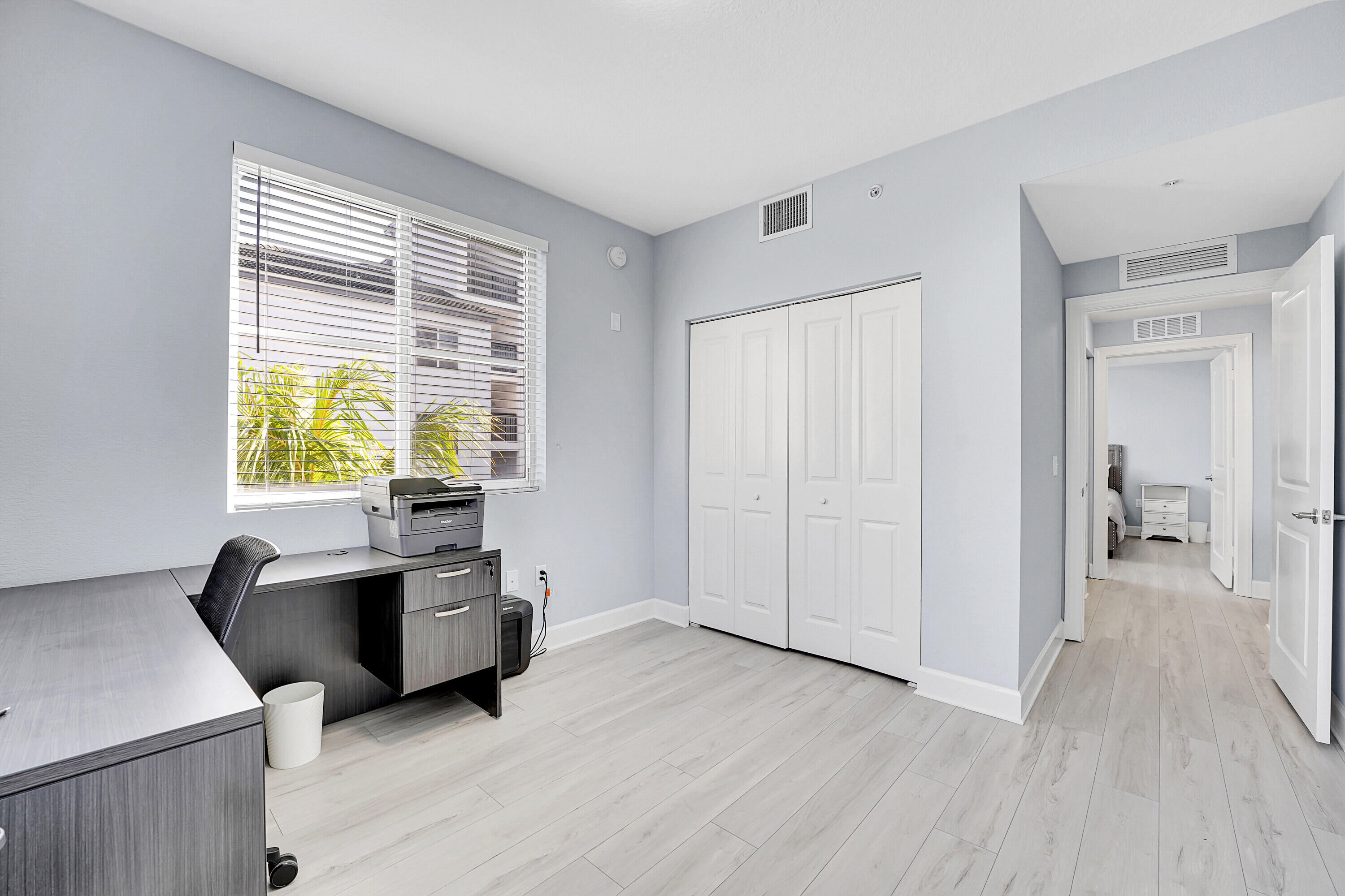 1690 Renaissance Commons Boulevard, Unit 1401 Boynton Beach, FL 33426 - Photo 26 of 43 a view of a workspace with furniture and a window