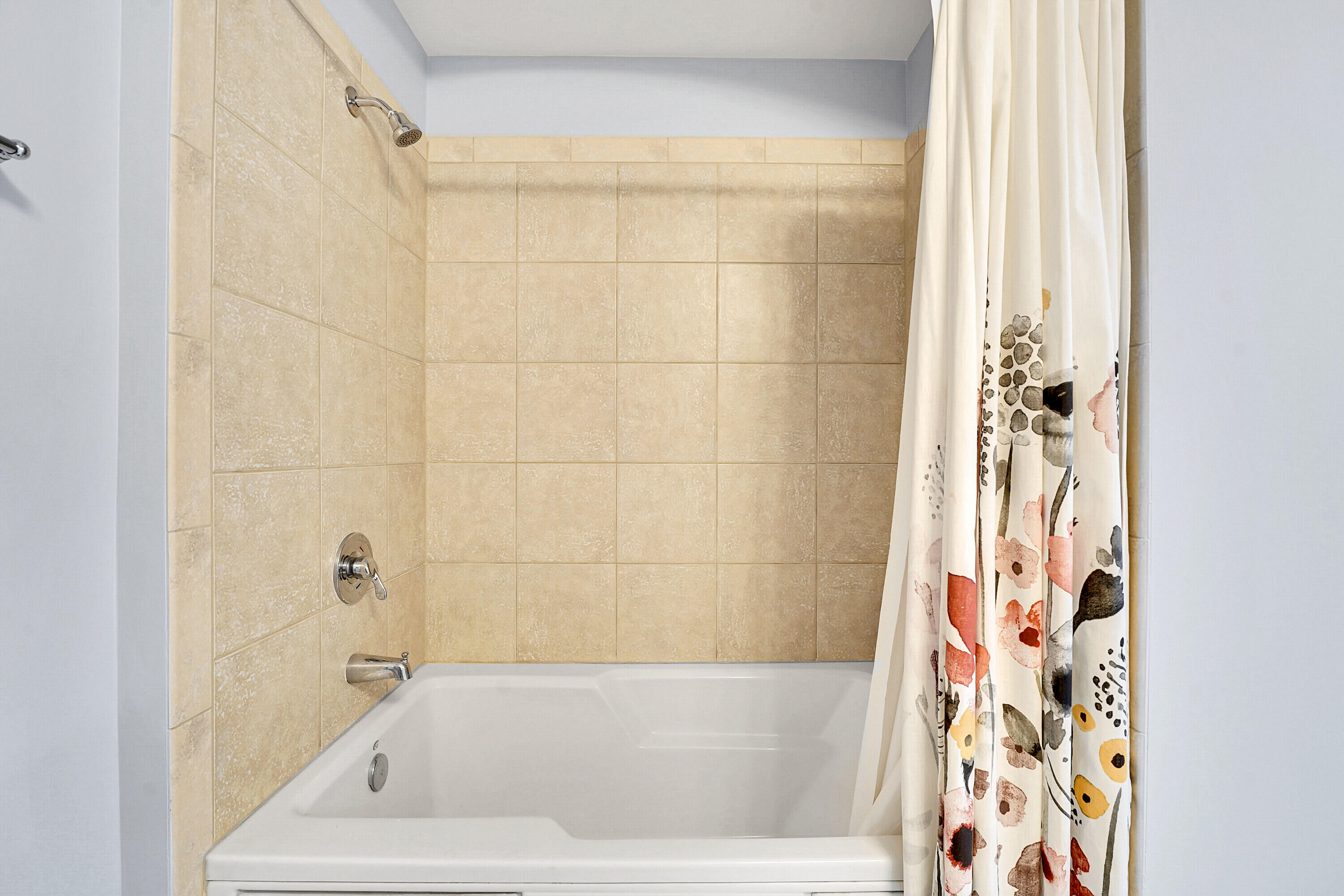 1690 Renaissance Commons Boulevard, Unit 1401 Boynton Beach, FL 33426 - Photo 28 of 43 a bathroom with a bathtub and shower