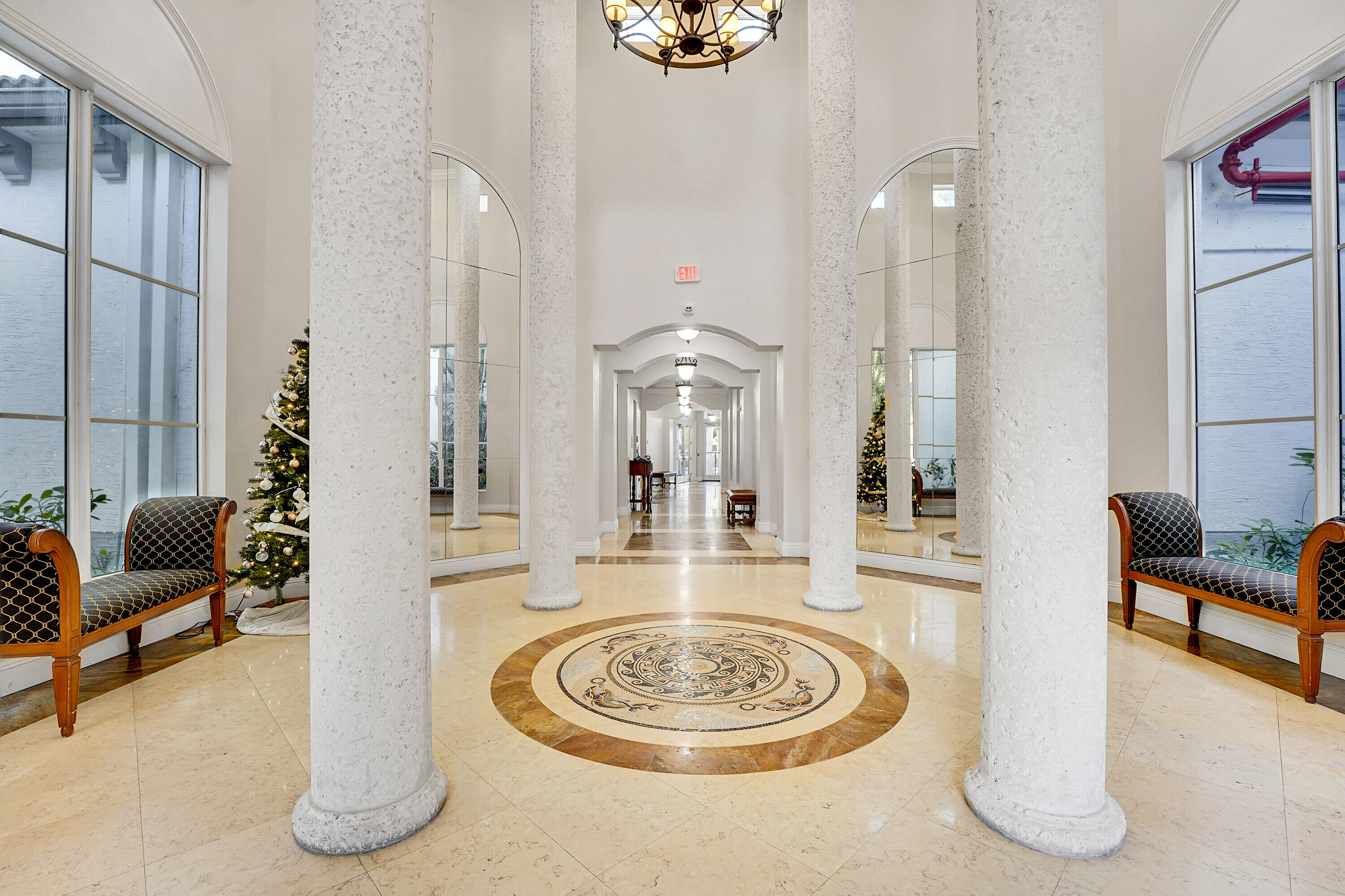 1690 Renaissance Commons Boulevard, Unit 1401 Boynton Beach, FL 33426 - Photo 30 of 43 a dining room with furniture and a large window