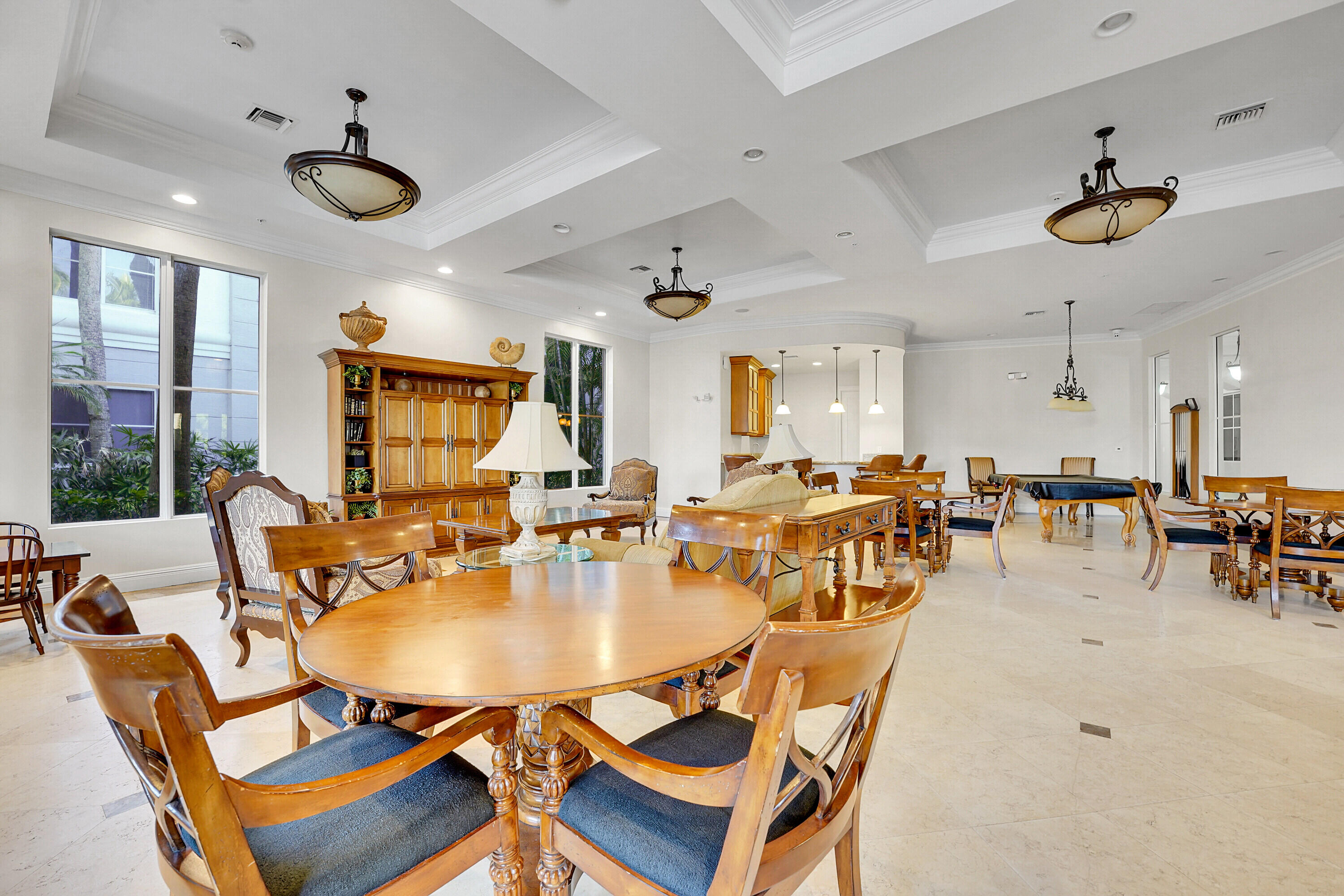 1690 Renaissance Commons Boulevard, Unit 1401 Boynton Beach, FL 33426 - Photo 34 of 43 a view of a dining room with furniture window and outside view