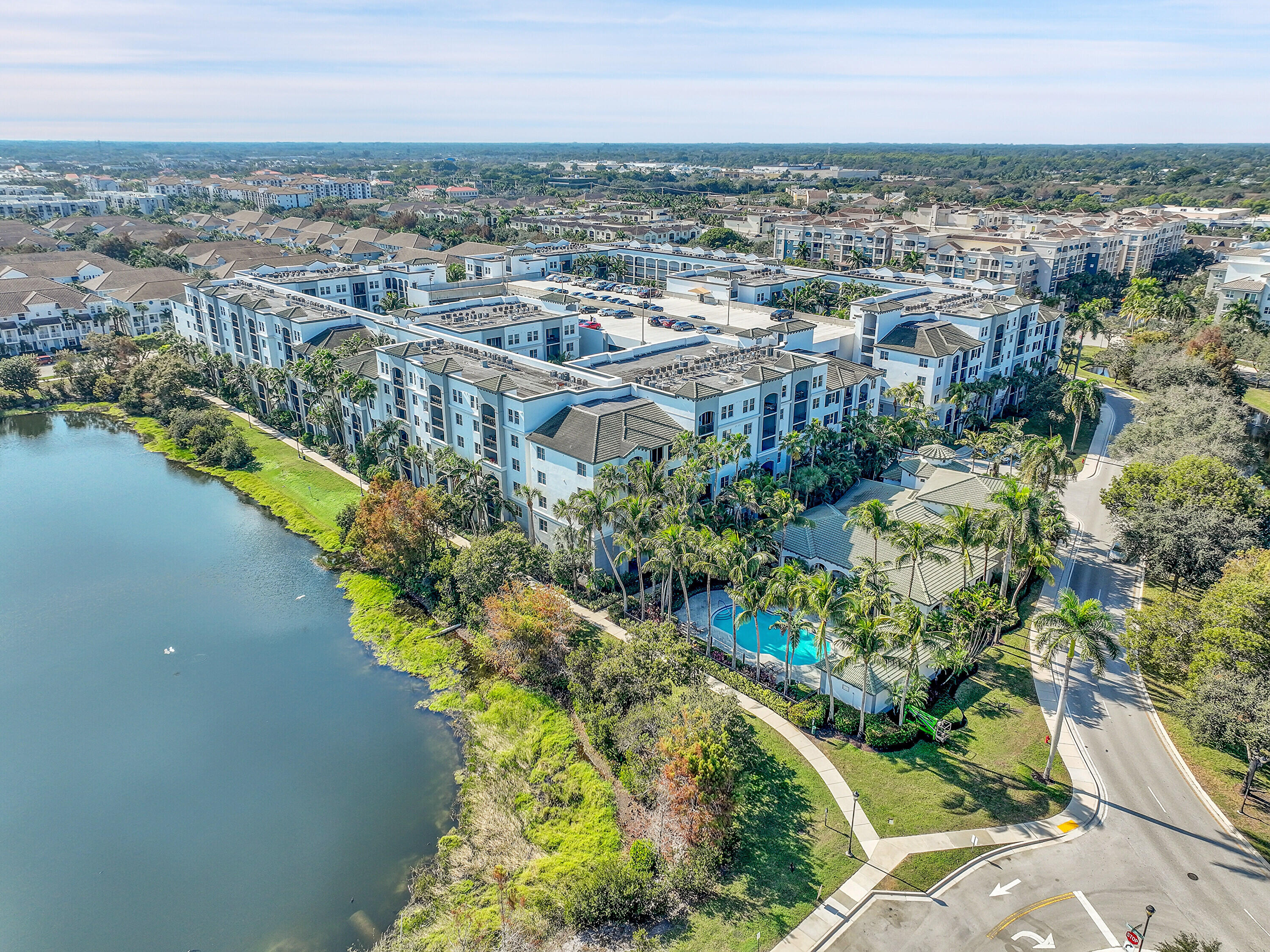 1690 Renaissance Commons Boulevard, Unit 1401 Boynton Beach, FL 33426 - Photo 41 of 43 an aerial view of a city with lots of residential buildings ocean and mountain view in back